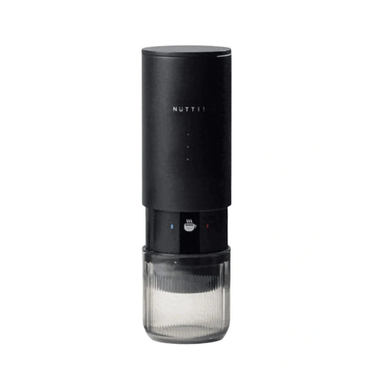 Black coffee grinder with glass container on a white background